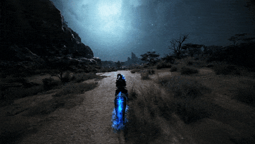 a person riding a horse on a dirt road