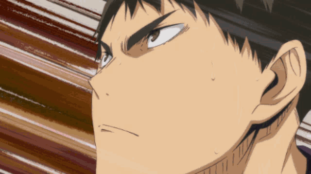 a close up of a person 's face with sweat coming out of his mouth