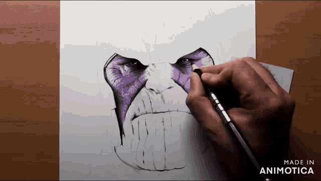 a person is drawing a face with purple paint on it
