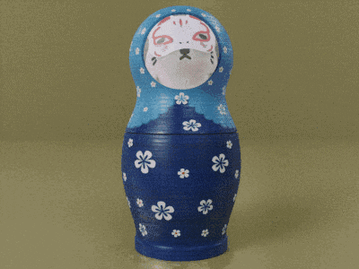 a blue green and orange matryoshka doll with a cat face