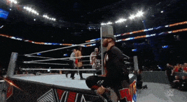 a wrestling ring with a sign that says slam