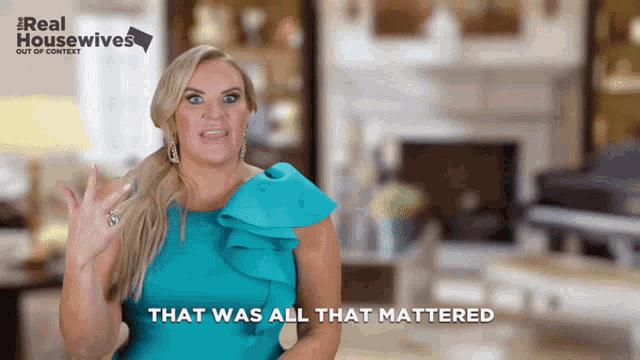 a woman says that was all that mattered in front of a real housewives sign