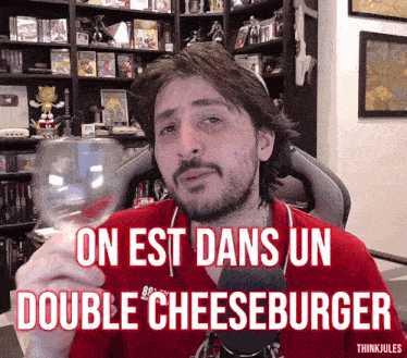 a man in a red shirt is holding a glass of wine with the words on est dans un double cheeseburger above him