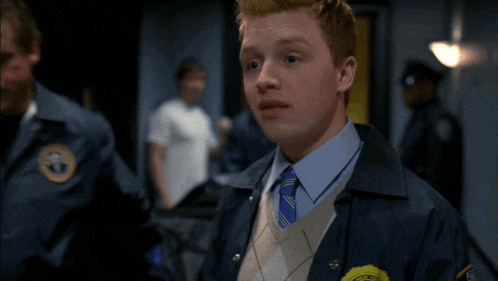 a man in a police uniform has a badge that says ' new york city ' on it