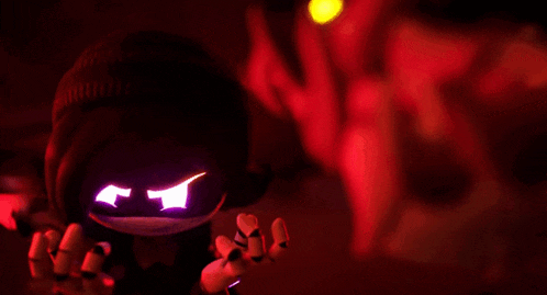 a stuffed animal with glowing eyes is standing in a dark room with a red light behind it .