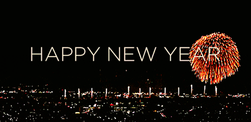 a happy new year greeting with fireworks displayed behind it