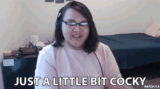 a woman wearing headphones and glasses says just a little bit cocky