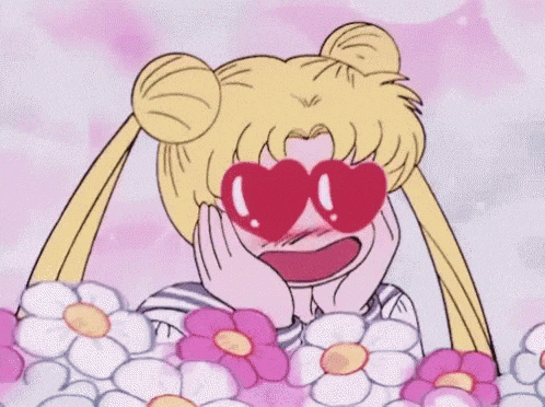 a cartoon of sailor moon wearing heart shaped sunglasses .