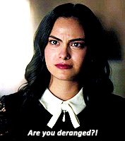 a woman in a black shirt and white collar is asking if she is deranged
