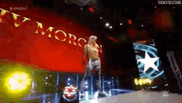 a man is standing in front of a banner that says ty morrison