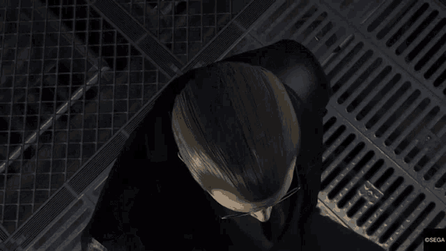 a man in a suit and tie is looking up at something in a video game
