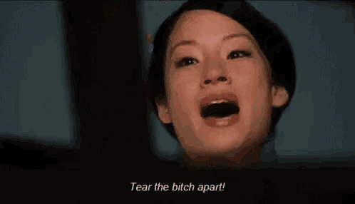 a woman is crying and saying `` tear the bitch apart ! ''