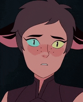 catra from she ra and the princesses of power is a cartoon character with short hair and green eyes .