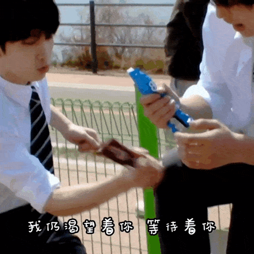 a man in a white shirt and tie is holding a pen with the number 8 on it while another man holds a piece of paper