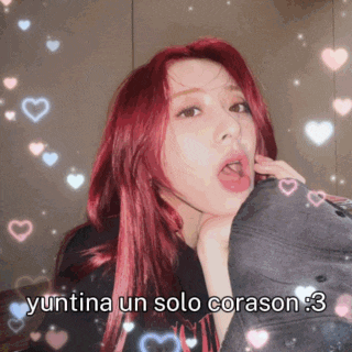 a woman with red hair is surrounded by hearts and the words yuntina un solo corazon 3