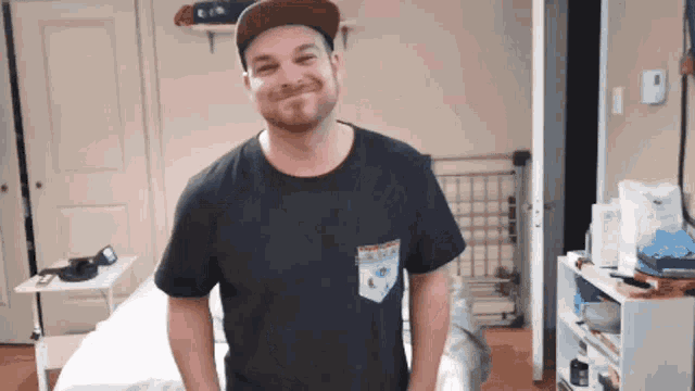 a man wearing a hat and a t-shirt with a pocket that says ' i love you '