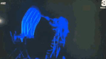 a screen shows a blue jellyfish with the number 8 on the bottom right