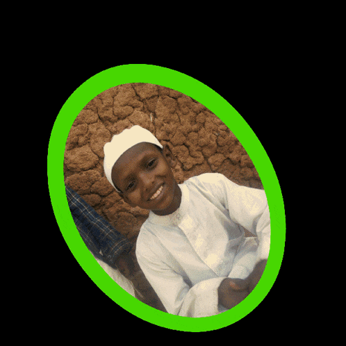 a young boy wearing a white hat and a white shirt is smiling