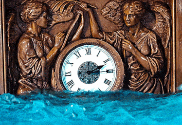 a clock with roman numerals on it is surrounded by angels