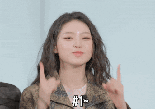 a woman giving the middle finger with the number 1 above her