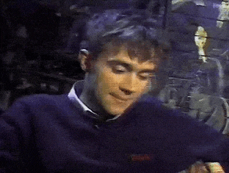 a close up of a man 's face with a blurred background .