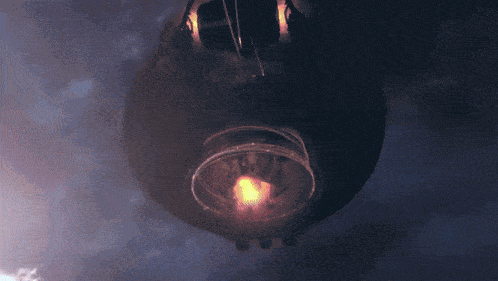 a close up of a glowing object in a dark sky