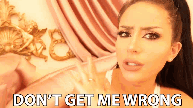 a woman laying on a bed with the words " do n't get me wrong " written on her face