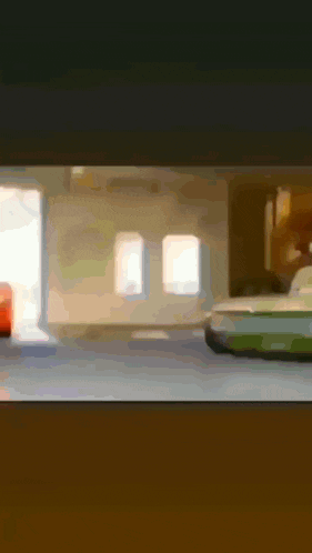 a blurred image of a car in a garage