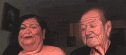 a man and a woman are standing next to each other