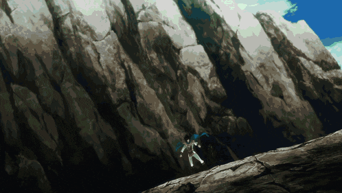 a person is falling down a rocky cliff