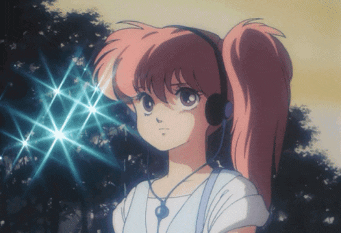 a girl with pink hair is wearing headphones and looking at something