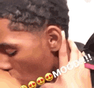 a close up of a person kissing another person 's neck with smiley faces on it .