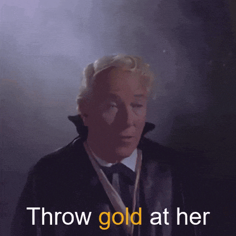 a man in a suit and tie is saying " throw gold at her "