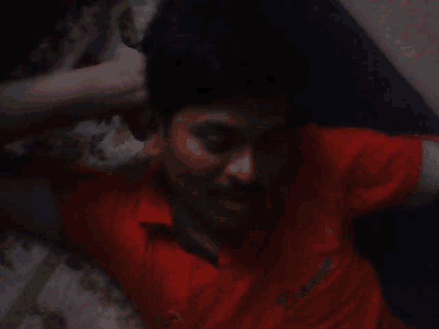 a man in a red shirt with the word pioneer on the front