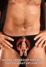 a man without a shirt is wearing a pair of underwear with a picture of a woman on it .
