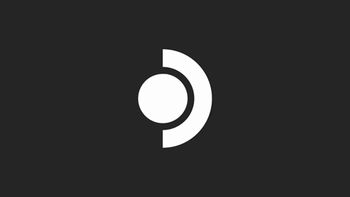 a white circle with a black circle in the middle on a black background .