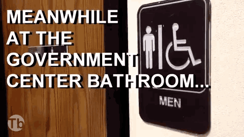 a sign for a handicapped men 's bathroom