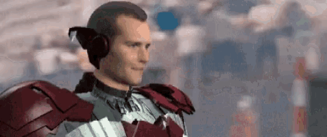 a man in a red and silver armor with headphones on