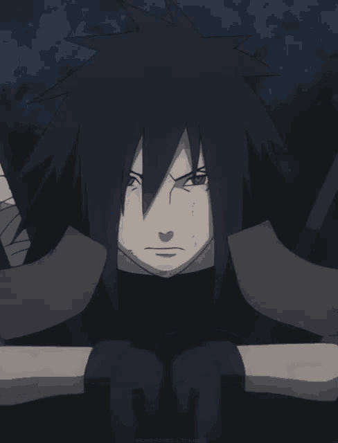 a close up of a person 's face with black hair