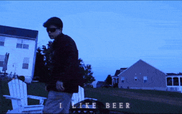 a man standing in front of a house with the words " i like beer " written below him