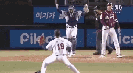 a baseball player with the number 19 on the back of his shirt