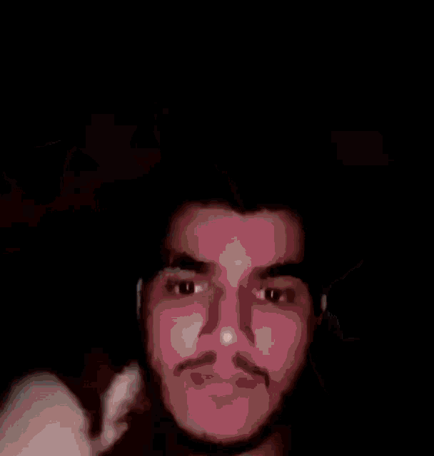 a close up of a man 's face with a blurred background