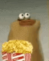 a cartoon character is holding a bucket of popcorn and smiling .