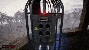 a video game is being played on a computer and a red light is shining on a machine .