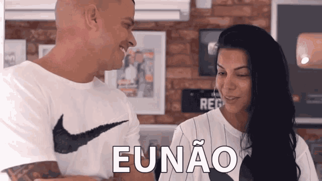 a man and a woman are standing next to each other and the woman is saying eunao .