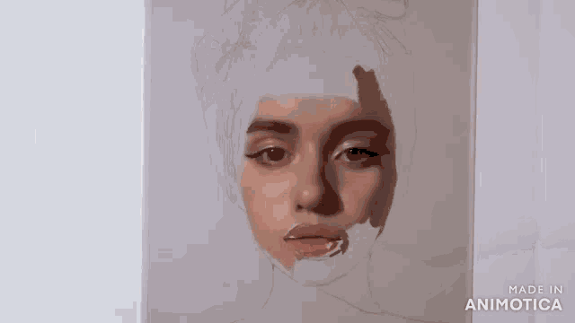 a painting of a woman 's face with a towel around her head is being made .