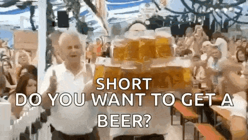 a man is carrying a stack of beer mugs with the words short do you want to get a beer written on it .