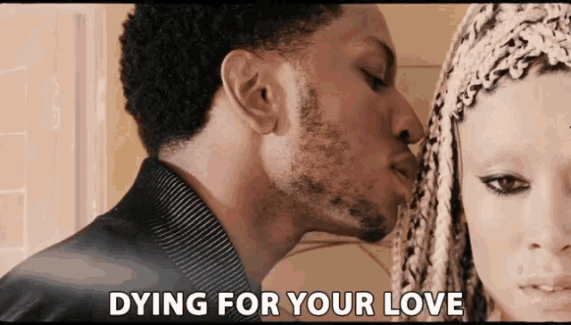 a man kissing a woman 's forehead with the words dying for your love above them