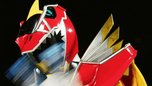 a toy that looks like a red dragon with a yellow tail