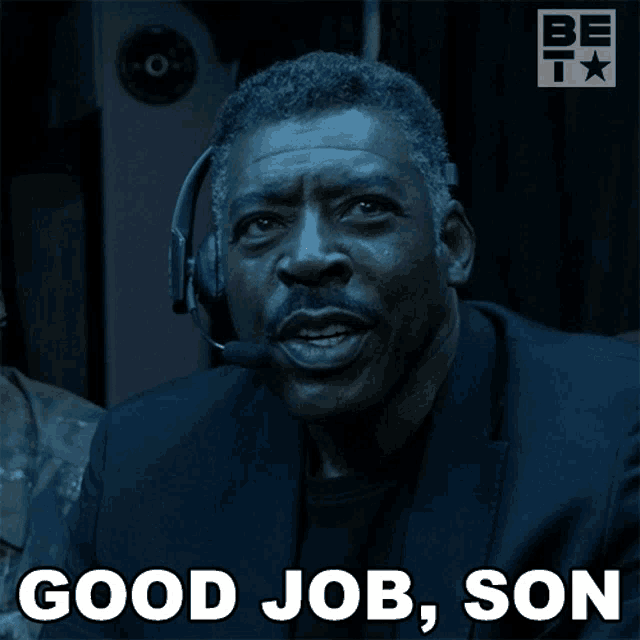 a man with a headset on says good job son